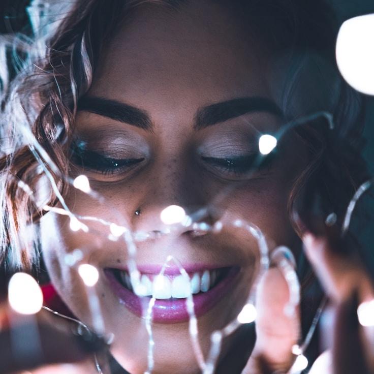 Ava Raman, Lead Design Curator at Collective Action Lab, reviewing corporate floral arrangements